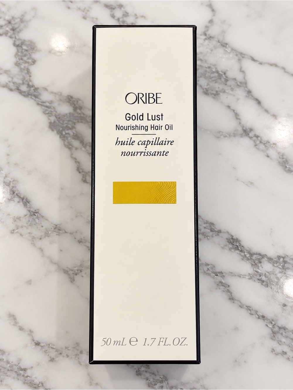 Oribe beige and black skincare box